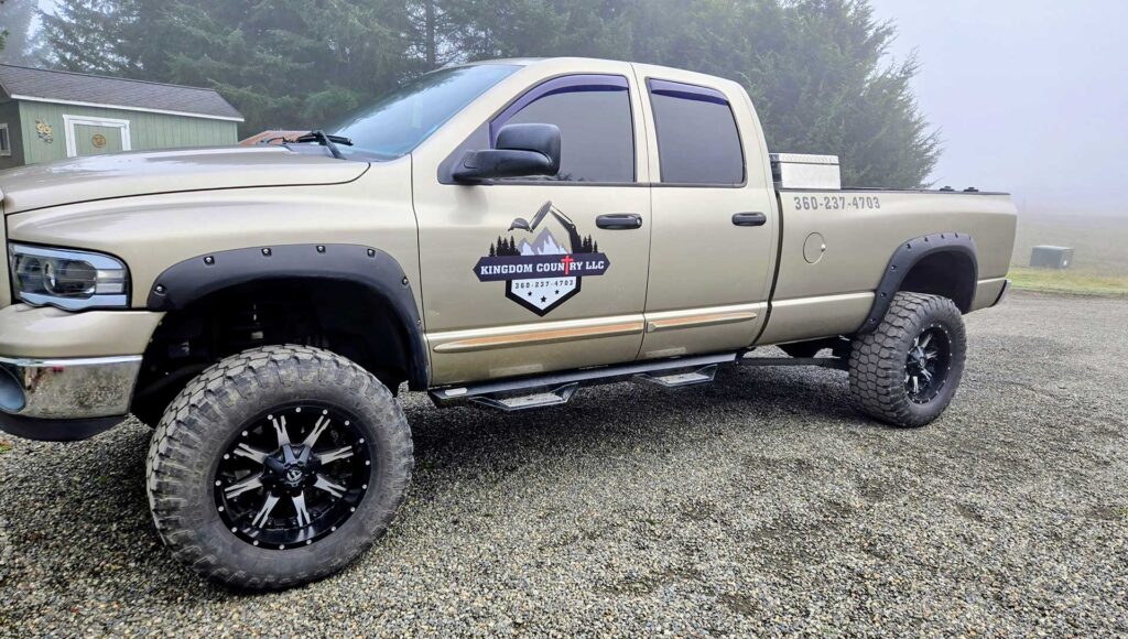 Kingdom Country LLC work truck with company branding